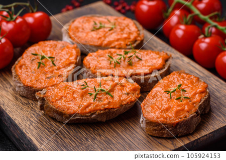 Delicious sandwich consisting of toast, red sauce with salt, spices and herbs Delicious sandwich consisting of toast, red sauce with salt, spices and herbs 105924153
