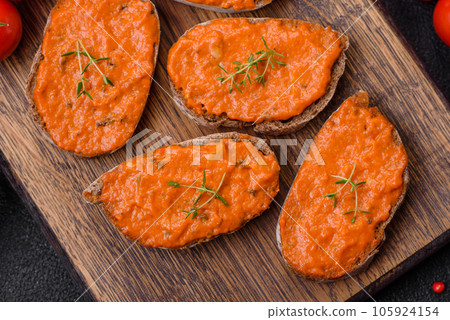 Delicious sandwich consisting of toast, red sauce with salt, spices and herbs 105924154