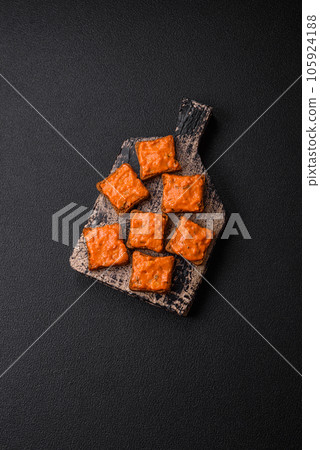 Delicious sandwich consisting of toast, red sauce with salt, spices and herbs Delicious sandwich consisting of toast, red sauce with salt, spices and herbs 105924188