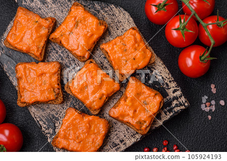 Delicious sandwich consisting of toast, red sauce with salt, spices and herbs Delicious sandwich consisting of toast, red sauce with salt, spices and herbs 105924193