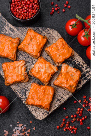 Delicious sandwich consisting of toast, red sauce with salt, spices and herbs Delicious sandwich consisting of toast, red sauce with salt, spices and herbs 105924194