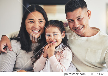 Smile, love and relax with family on sofa for happy, bonding and support. Hug, happiness and lounge with Mexico parents with child and embrace in living room at home for calm, cheerful and peace 105924326