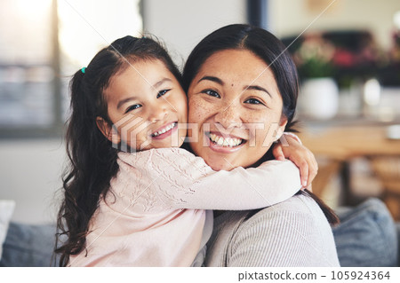 Smile, mother and daughter hug for a portrait at home with love, care and happiness. A young woman and girl child together on a lounge sofa for fun time, playing and security or relax in family house 105924364