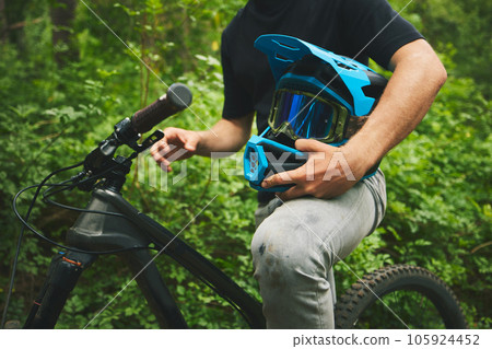 Mountain bike, man and helmet, forest and sports with adventure and fitness in nature outdoor. Cycling, biker and travel with athlete, exercise training and ready to ride, bicycle and challenge Mountain bike, man and helmet, forest and sports with adventure and fitness in nature outdoor. Cycling, biker and travel with athlete, exercise training and ready to ride, bicycle and challenge 105924452