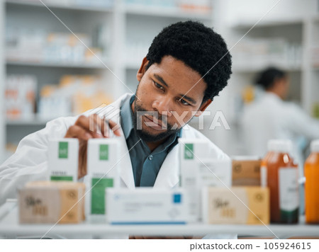 Black man, pharmacist and check stock, pills and health, prescription medicine and supplements in pharmacy. Organize inventory, healthcare and medical, hospital dispensary and pharmaceutical drugs 105924615