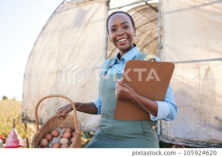 Portrait, farm and black woman with clipboard and chicken eggs for sustainability, agriculture and supply chain in countryside. Face, smile and farmer with checklist or poultry, produce or management Portrait, farm and black woman with clipboard and chicken eggs for sustainability, agriculture and supply chain in countryside. Face, smile and farmer with checklist or poultry, produce or management 105924620