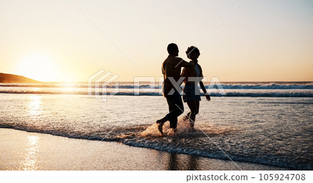 Beach sunset, sea water and silhouette couple walking, connect or enjoy romantic holiday in South Africa. Love, ocean waves and dark shadow of summer people bond, talking and relax on evening journey 105924708