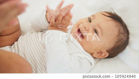 Infant baby, clapping hands and bed with parent, care or learning with smile, love or childhood development. Young happy kid, nursery or bedroom with teaching, applause or excited face in family home Infant baby, clapping hands and bed with parent, care or learning with smile, love or childhood development. Young happy kid, nursery or bedroom with teaching, applause or excited face in family home 105924940