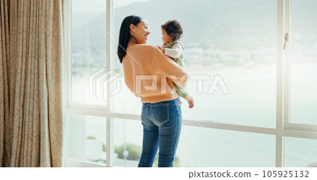 Care, happy and a mother with a baby in a house and looking at the view from a window. Smile, hug and a young mom holding a child for playing, bonding or love together in the morning as family Care, happy and a mother with a baby in a house and looking at the view from a window. Smile, hug and a young mom holding a child for playing, bonding or love together in the morning as family 105925132