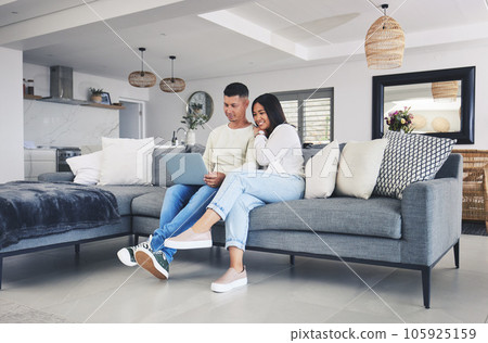 Couple, laptop and streaming a movie on the sofa in home, living room or together watching tv, film or video on social media. Happy, people and relax on computer with online movies or comedy show Couple, laptop and streaming a movie on the sofa in home, living room or together watching tv, film or video on social media. Happy, people and relax on computer with online movies or comedy show 105925159