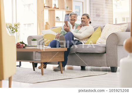 Selfie, happy and mature couple on sofa with smile for social media post, profile picture and memories. Marriage, love and man and woman take photo in living room for bonding, relationship and relax Selfie, happy and mature couple on sofa with smile for social media post, profile picture and memories. Marriage, love and man and woman take photo in living room for bonding, relationship and relax 105925208