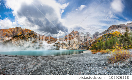 Spectacular autumn view of Oeschinensee Lake. Spectacular autumn view of Oeschinensee Lake. 105926318