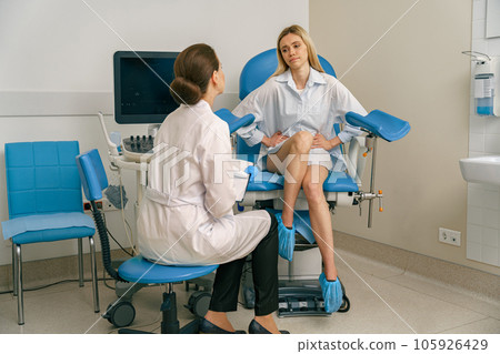 Sad woman on appointment with her gynecologist during regular visit to women's consultation Sad woman on appointment with her gynecologist during regular visit to women's consultation 105926429