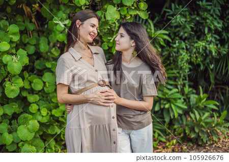 A heartwarming moment captured in the park as a pregnant woman after 40 shares a special bond with her teenage daughter, embracing the beauty of mother-daughter connection A heartwarming moment captured in the park as a pregnant woman after 40 shares a special bond with her teenage daughter, embracing the beauty of mother-daughter connection 105926676