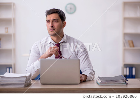 Young male employee working in the office 105926866