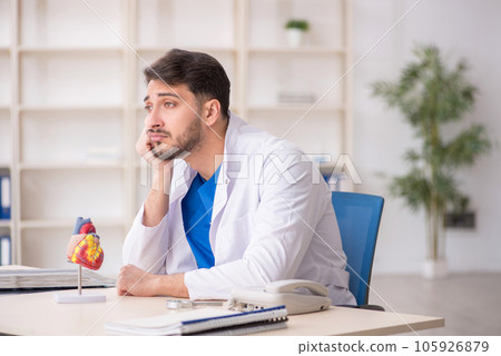 Young male doctor cardiologist working in the clinic 105926879