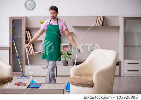 Young male contractor cleaning the house 105926890