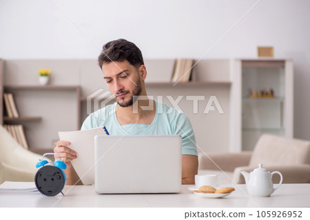 Young male freelancer working from home 105926952