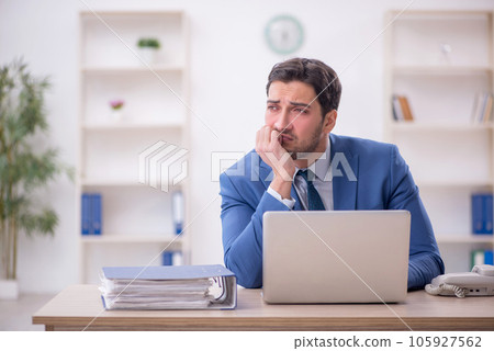 Young male employee working in the office 105927562