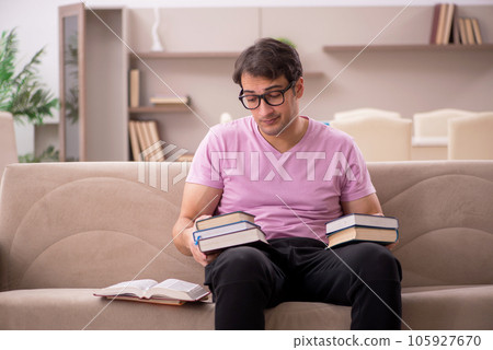 Young male student preparing for exams at home 105927670