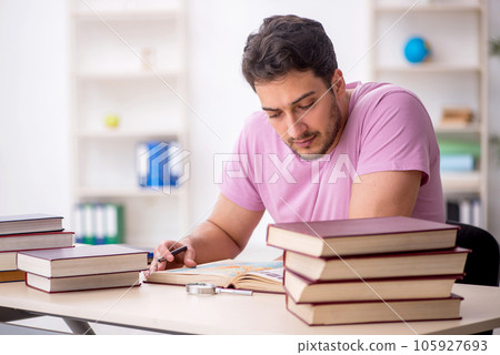 Young male student sitting in the classroom Young male student sitting in the classroom 105927693