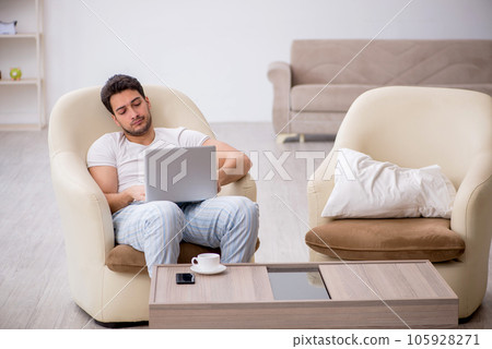 Young man starting day at home 105928271