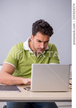 Young male student in telestudying concept Young male student in telestudying concept 105928374