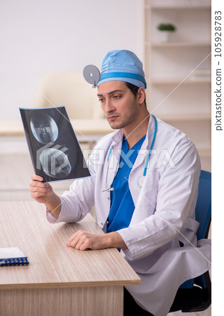 Young male doctor radiologist working in the clinic Young male doctor radiologist working in the clinic 105928783