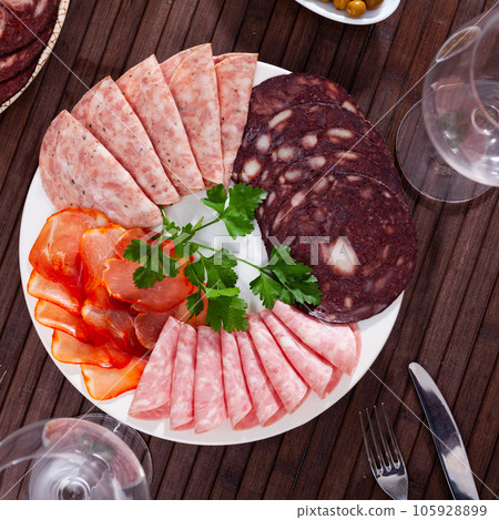 Appetizer of various types of Spanish sausages 105928899