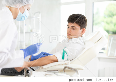 Intravenously injection male patient 105929136