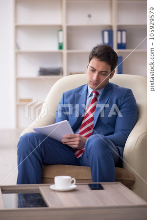 Young male employee sitting in the office 105929579