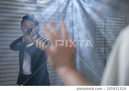 An image of an agent pointing a gun at a criminal An image of an agent pointing a gun at a criminal 105931319