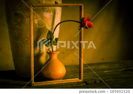 Red roses made from stockings in old vases on wooden floors,still life concept 105931520