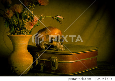 Human skull and flower vase old treasure on wooden table background, Still life concept 105931523