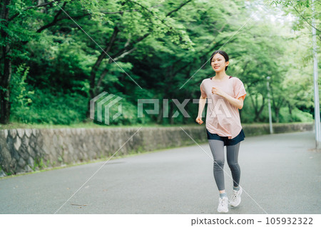 A woman who jogs A woman who jogs 105932322
