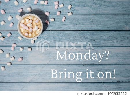 MONDAY BRING IT ON concept text with white cup of coffee and marshmallows on wooden background. The most depressing day of the year in January. Day commit suicide and depression MONDAY BRING IT ON concept text with white cup of coffee and marshmallows on wooden background. The most depressing day of the year in January. Day commit suicide and depression 105933312