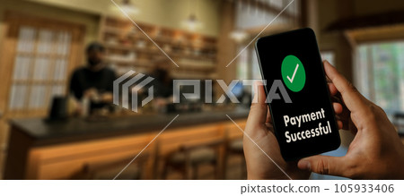 customer using a smartphone Online Money Transfer Confirmed at the cafe coffee Technology lifestyle payment screen a banking payment on a mobile phone 105933406
