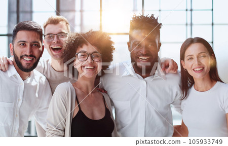 Smiling professional business leaders and employees group team portrait Smiling professional business leaders and employees group team portrait 105933749