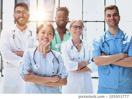 multinational group of doctors and interns standing together. multinational group of doctors and interns standing together. 105933777