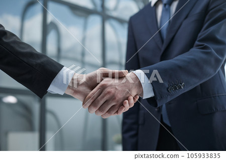 close up. handshake of business partners in the background of the office. 105933835
