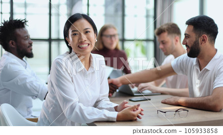 Happy young woman and looking at the camera. Portrait of a smiling businesswoman in the office Happy young woman and looking at the camera. Portrait of a smiling businesswoman in the office 105933858