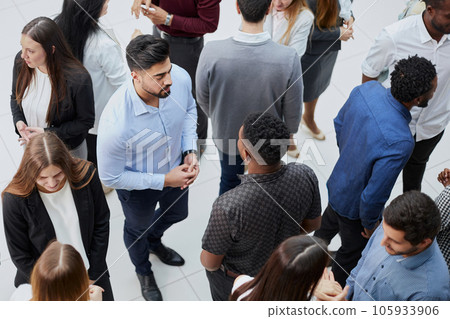 Coworkers having business meeting in a lobby Coworkers having business meeting in a lobby 105933906