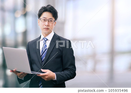 Laptop computer and businessman 105935496