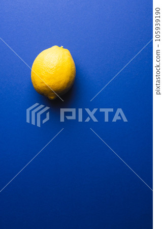 Close up of lemon and copy space on blue background 105939190