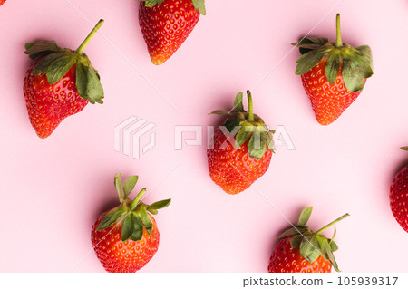 Close up of strawberries and copy space on pink background Close up of strawberries and copy space on pink background 105939317