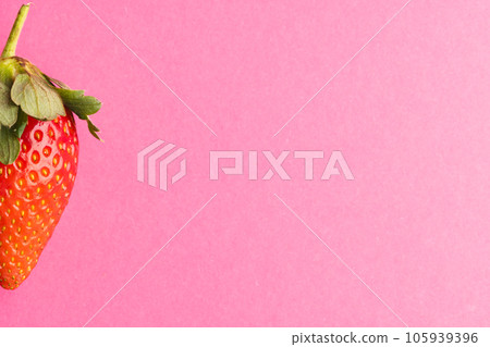 Close up of strawberry and copy space on pink background 105939396