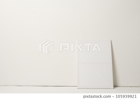 White canvas and copy space leaning against white wall background White canvas and copy space leaning against white wall background 105939921