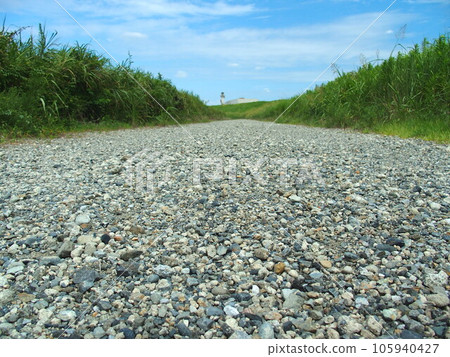 Gravel road scenery of Edogawa riverbed in summer Gravel road scenery of Edogawa riverbed in summer 105940427