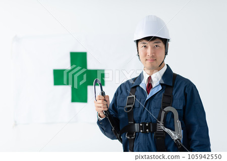 Safety image of a man wearing a full harness type fall arrest device Safety image of a man wearing a full harness type fall arrest device 105942550