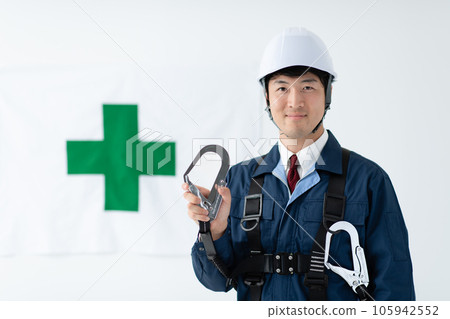 Safety image of a man wearing a full harness type fall arrest device Safety image of a man wearing a full harness type fall arrest device 105942552